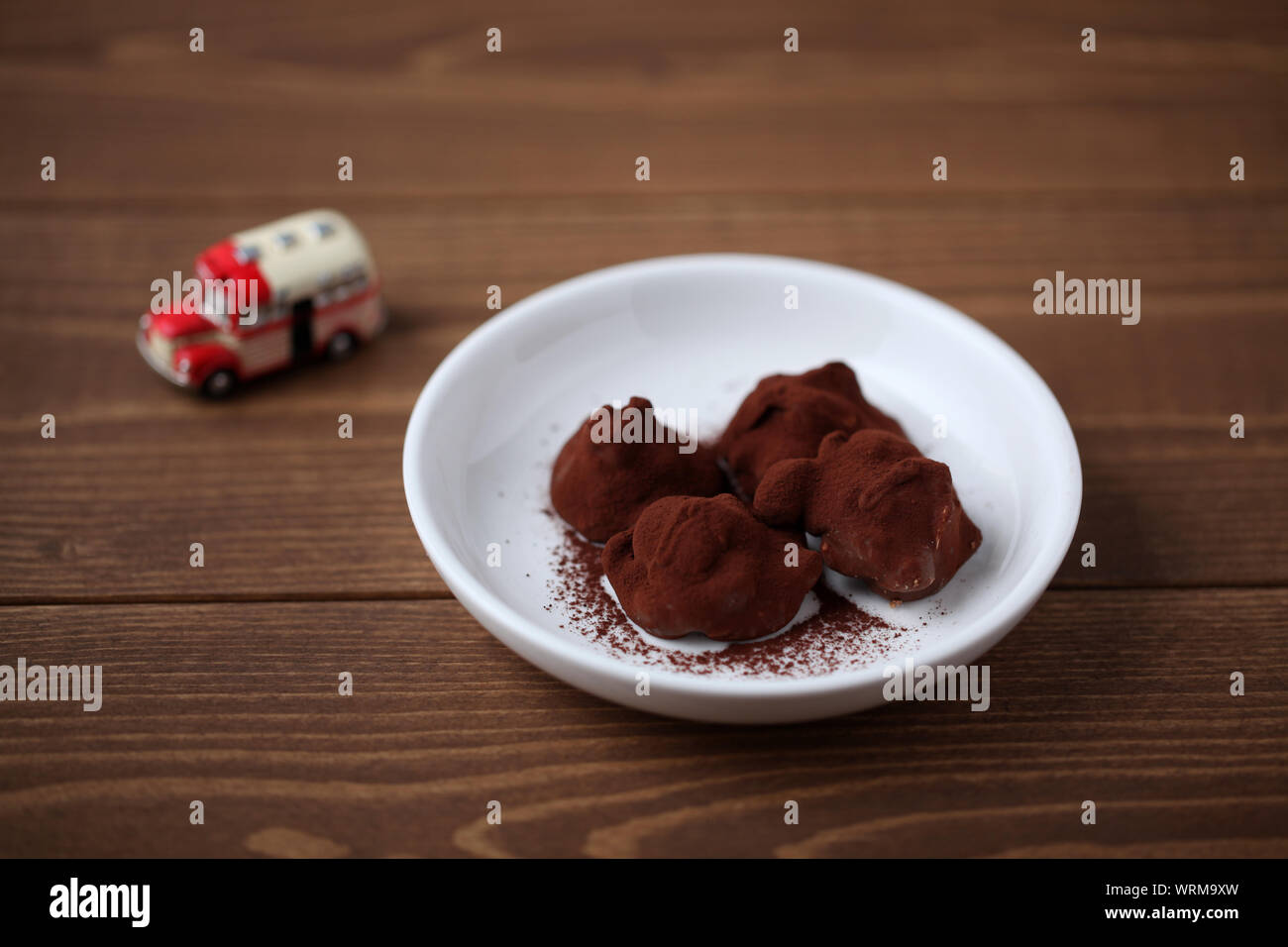 chocolate ganache crunch isolated on wooden table Stock Photo