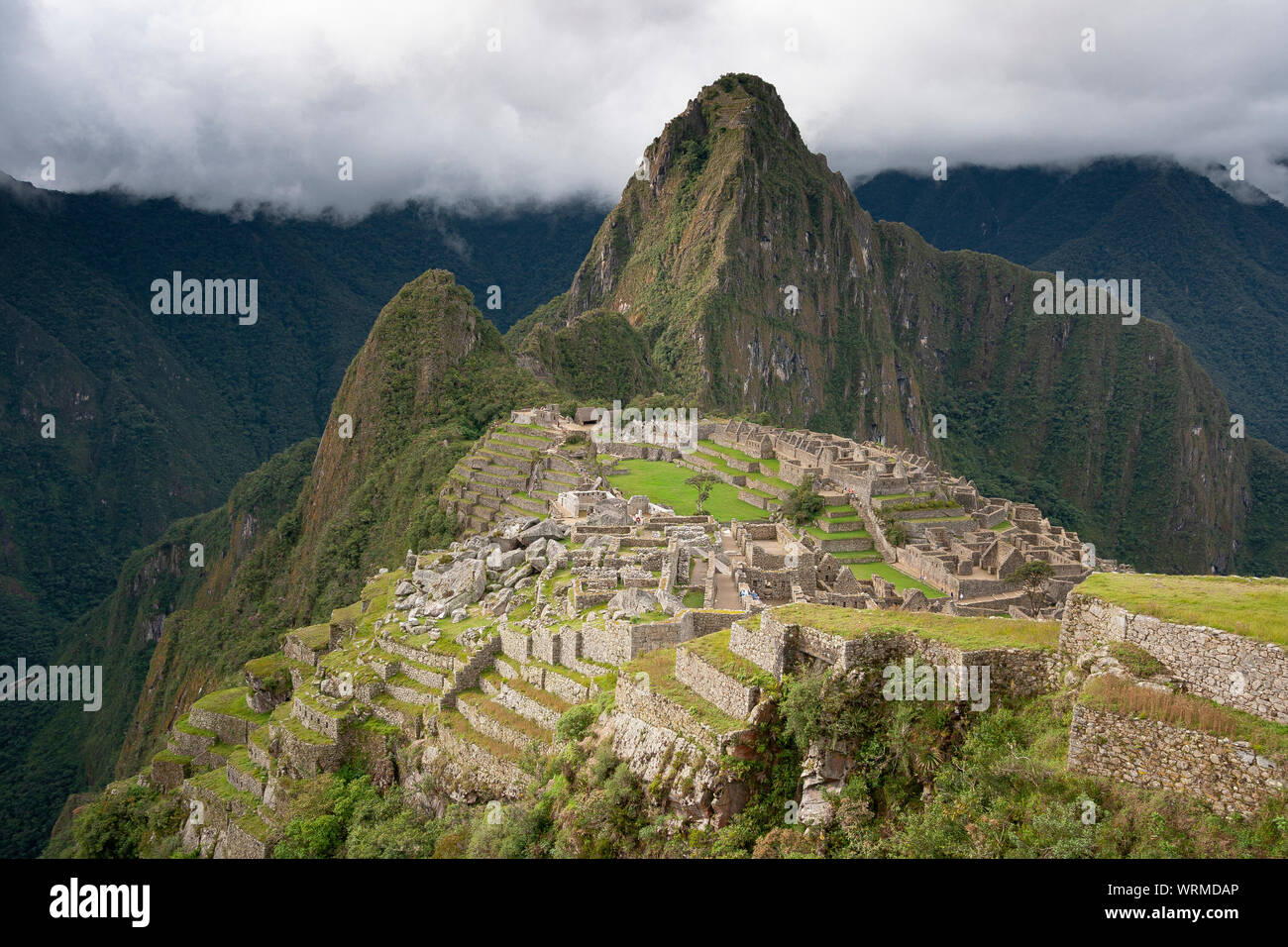 Machu Picchu ruins with cloudy sky in the back Stock Photo - Alamy