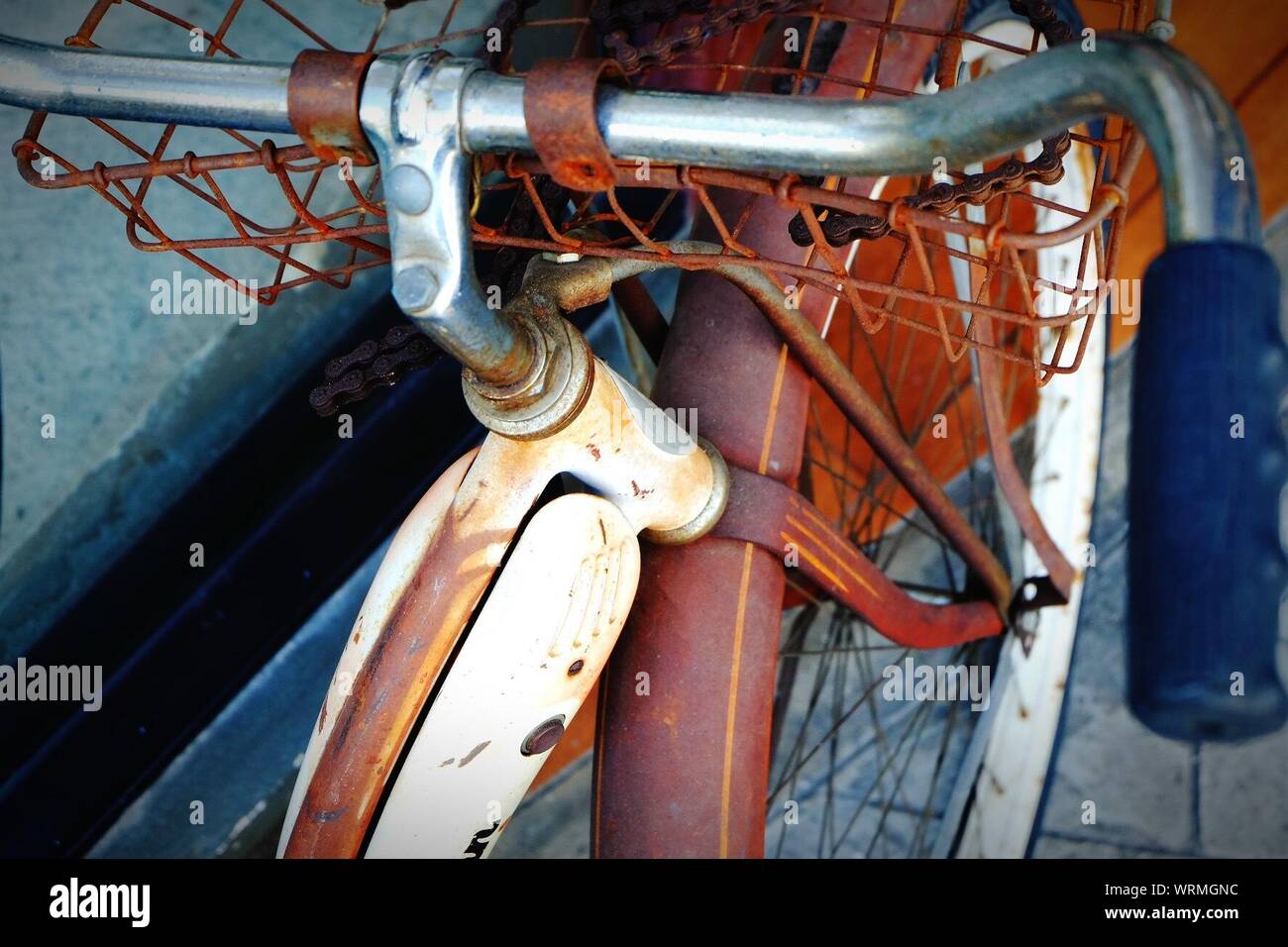 High Angle View Of Rusty Bicycle Handle And Wheel Stock Photo