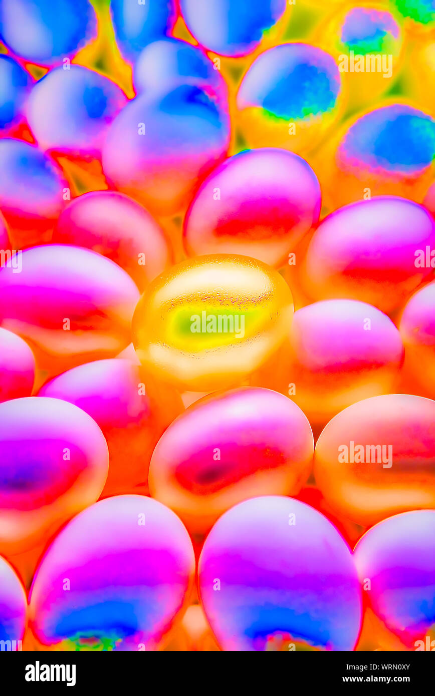 Digitally manipulated golden egg sitting in the middle of a field of