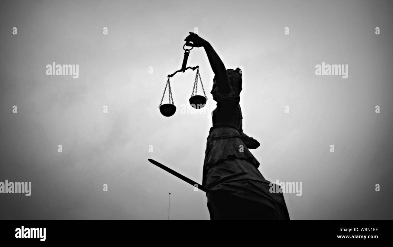 Low Angle View Of Justitia Statue Against Sky Stock Photo