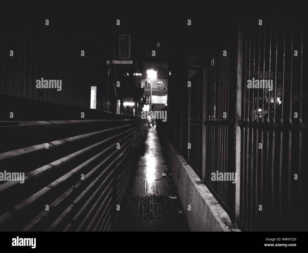 Illuminated Walkway At Night Stock Photo - Alamy