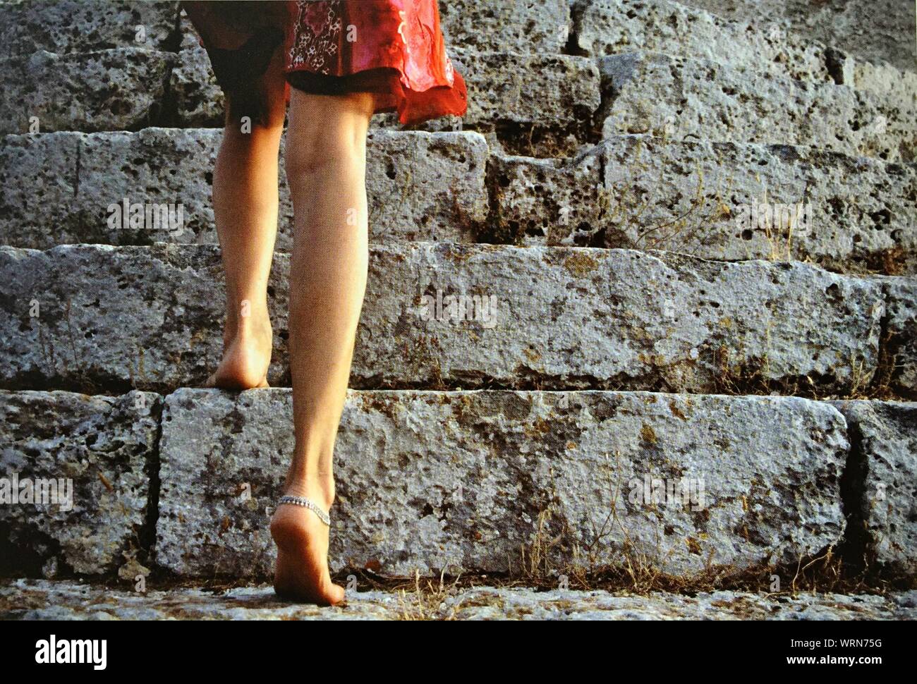 Woman climbing steps hires stock photography and images Alamy