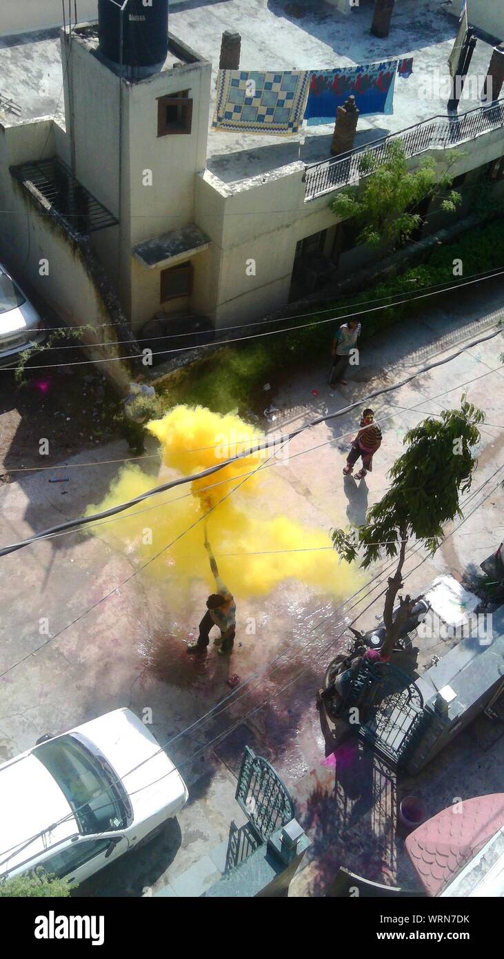 High Angle View Of People Throwing Color At Holi Festival Stock Photo