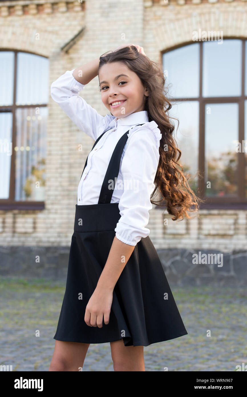 Classic style. Formal clothes for visiting school. Daily outfit. Adorable  schoolgirl. Perfect matching clothes. Kids clothes. School fashion. Girl  wear fashionable outfit. White shirt and black dress Stock Photo - Alamy