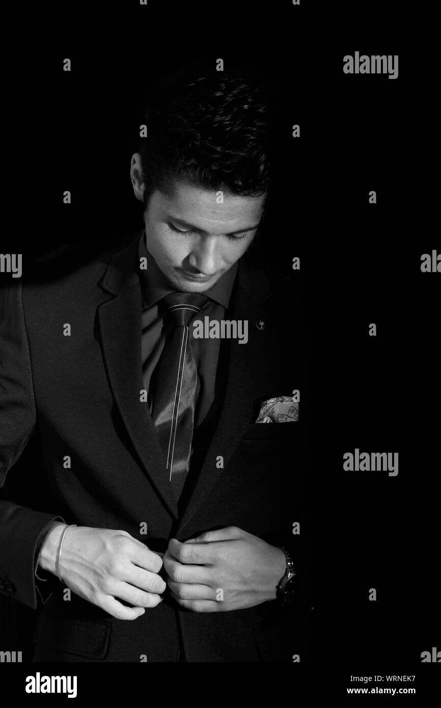 Man, standing, black suit hi-res stock photography and images - Alamy