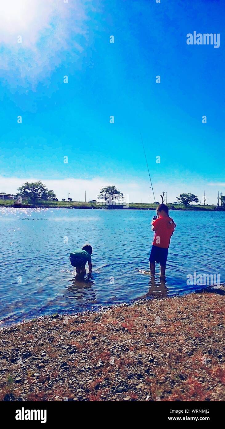 Two boys fishing hi-res stock photography and images - Alamy