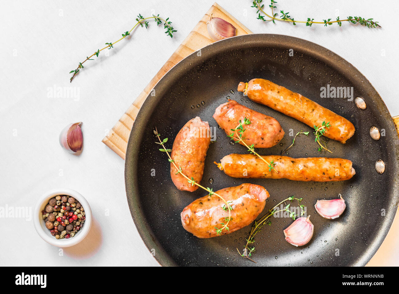 Grilled barbecue chorizo meat sausages in a frying pan. Stock Photo