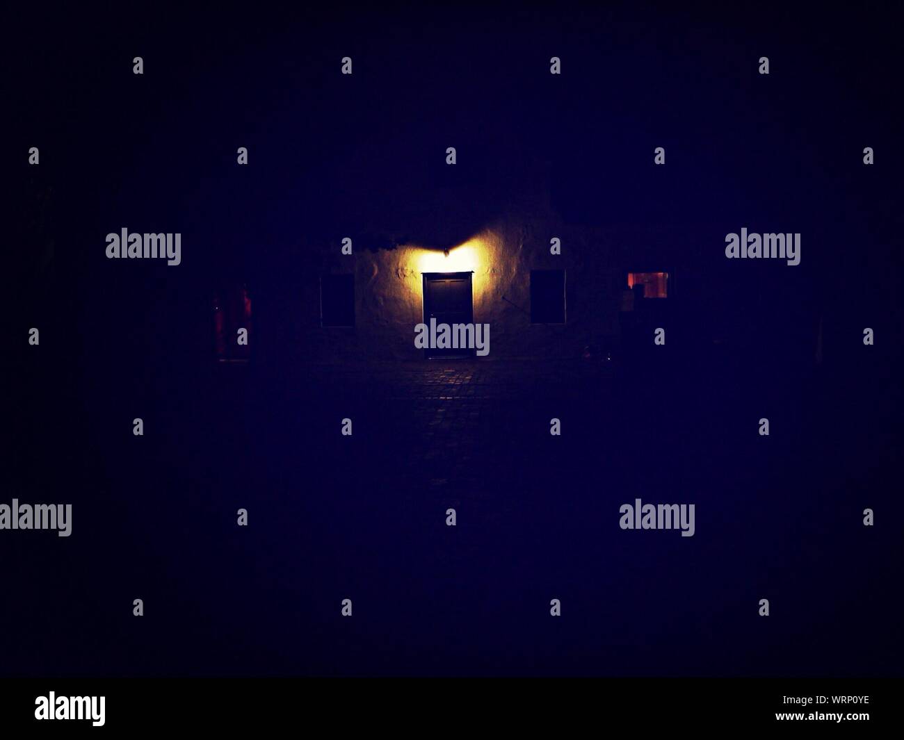 Dark Room With Light In Distance Stock Photo Alamy