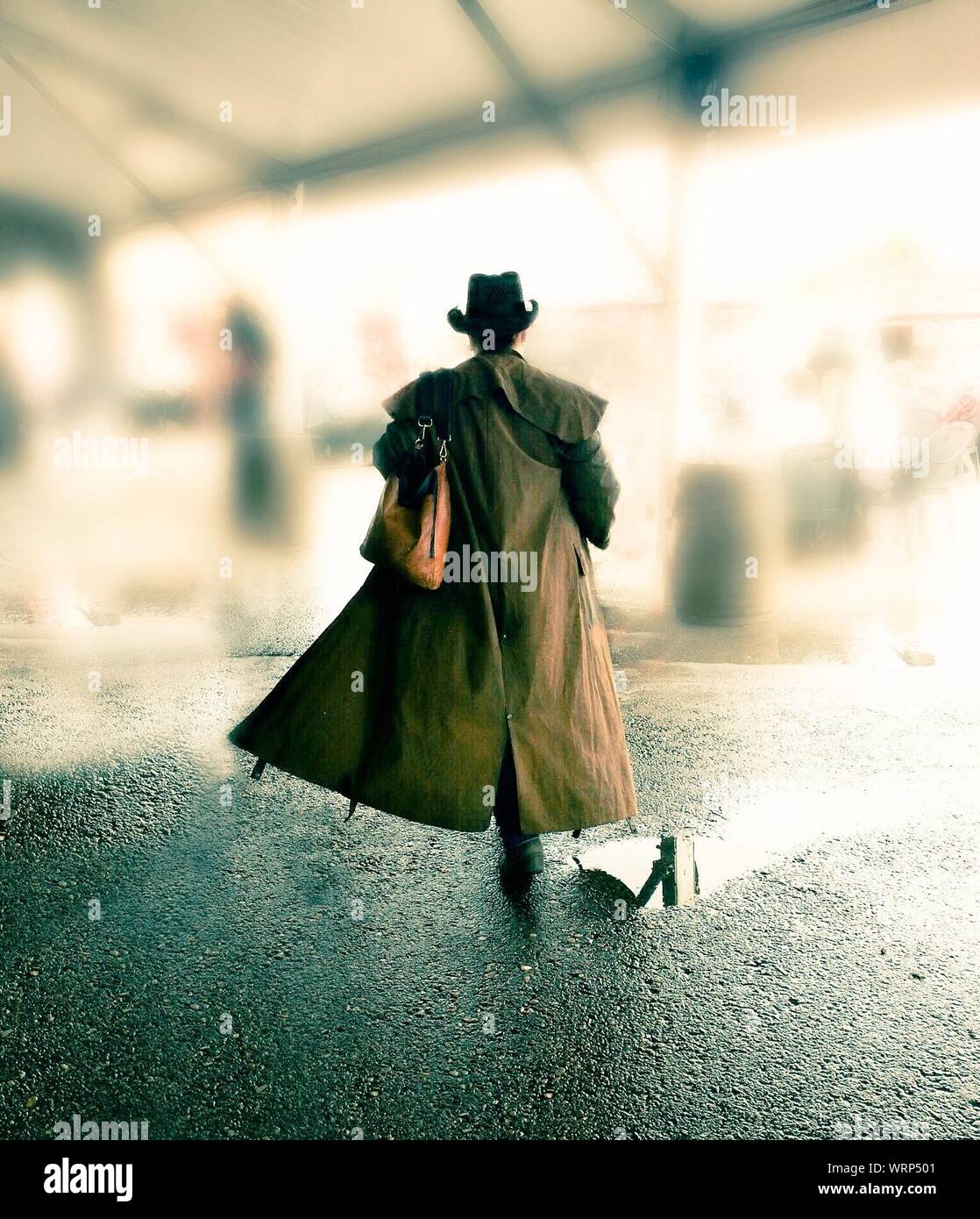 Woman walking coat hi-res stock photography and images - Alamy