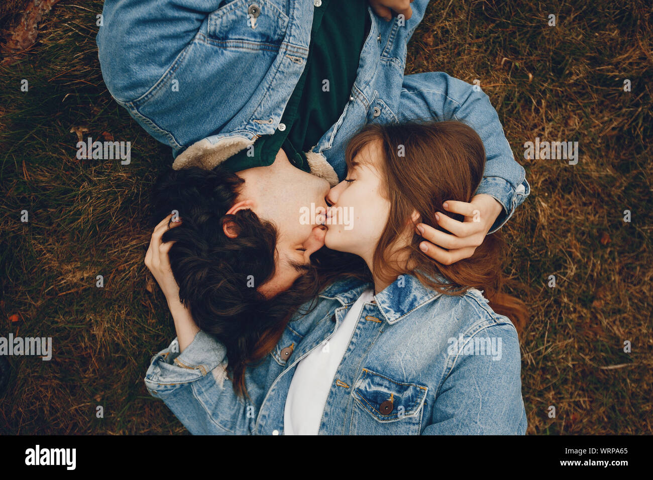 Young couple in love sit hi-res stock photography and images - Alamy