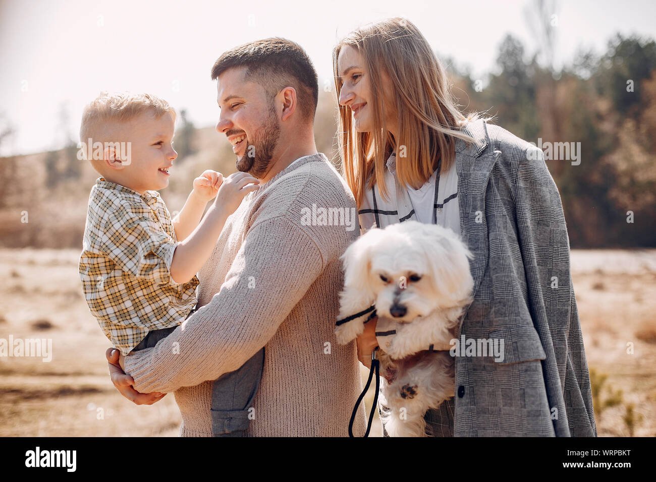 Cute family playing in a spring park Stock Photo