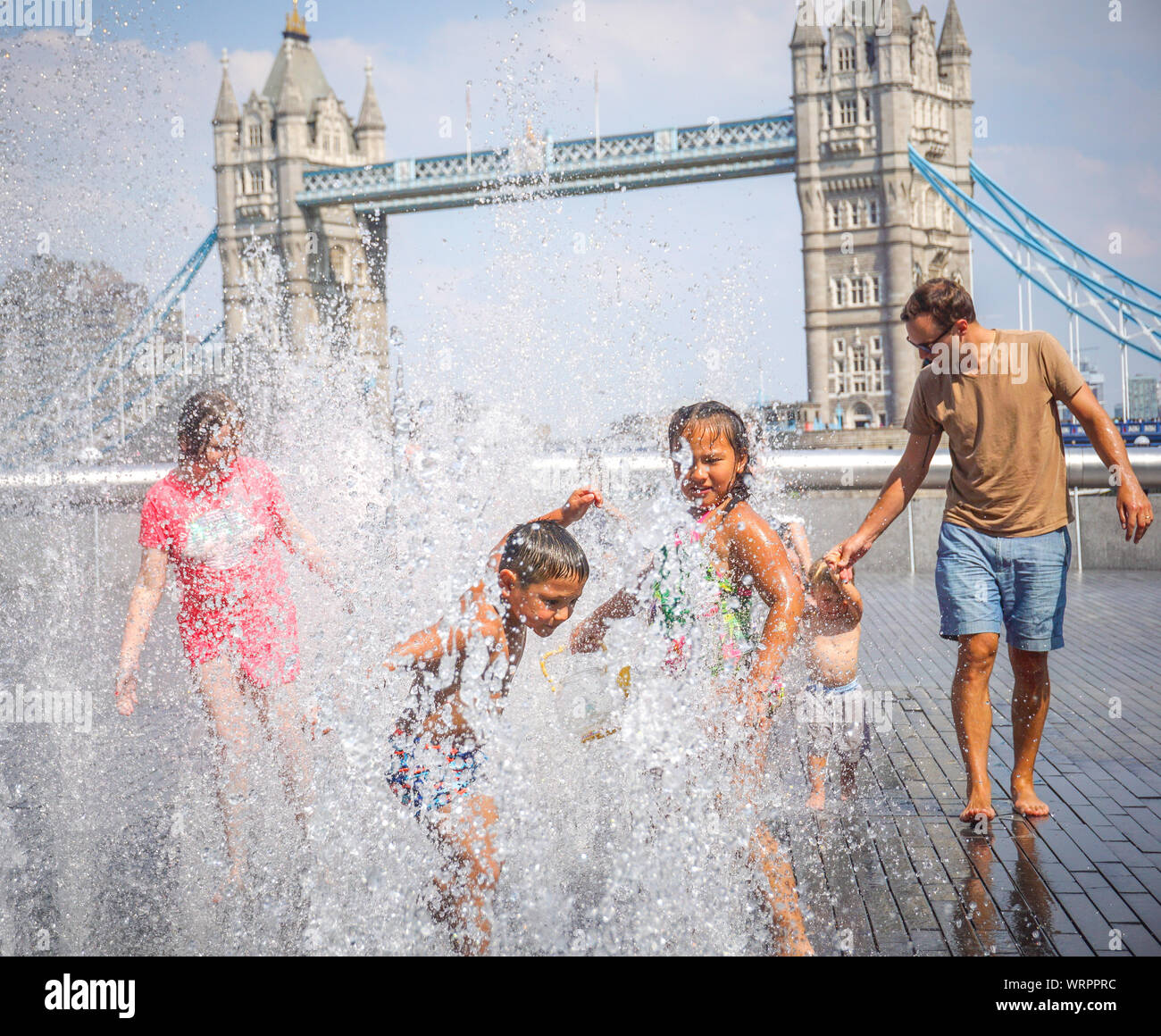 Kids seen playing at a water fountain and cooling down on a hot day on the  South Bank in Central London. Photo by Ioannis Alexopoulos / Alamy Stock  Photo - Alamy