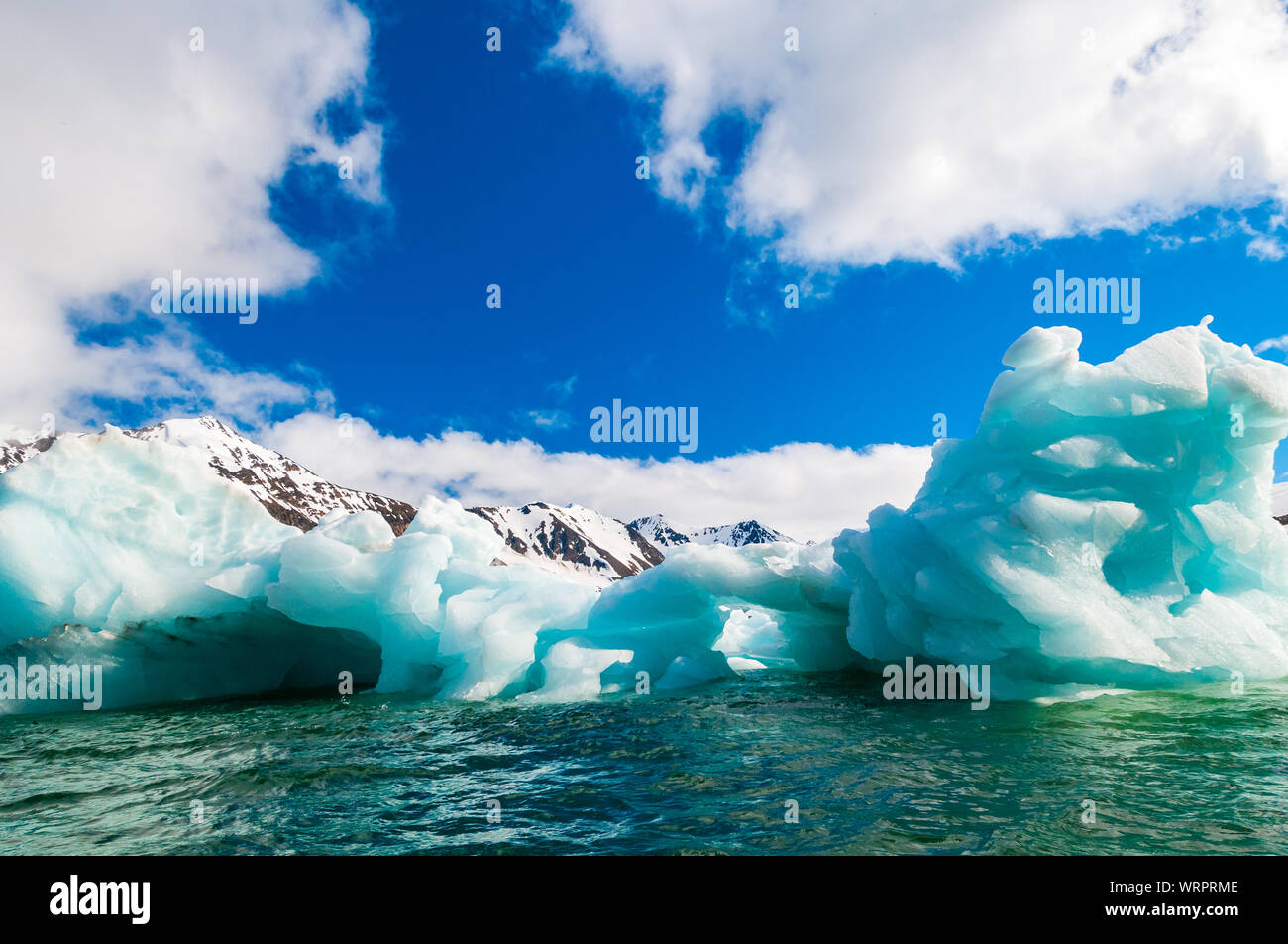 Close up of blue green icebergs floating in a fjord in Hornsund, Svalbard, Norway. Stock Photo