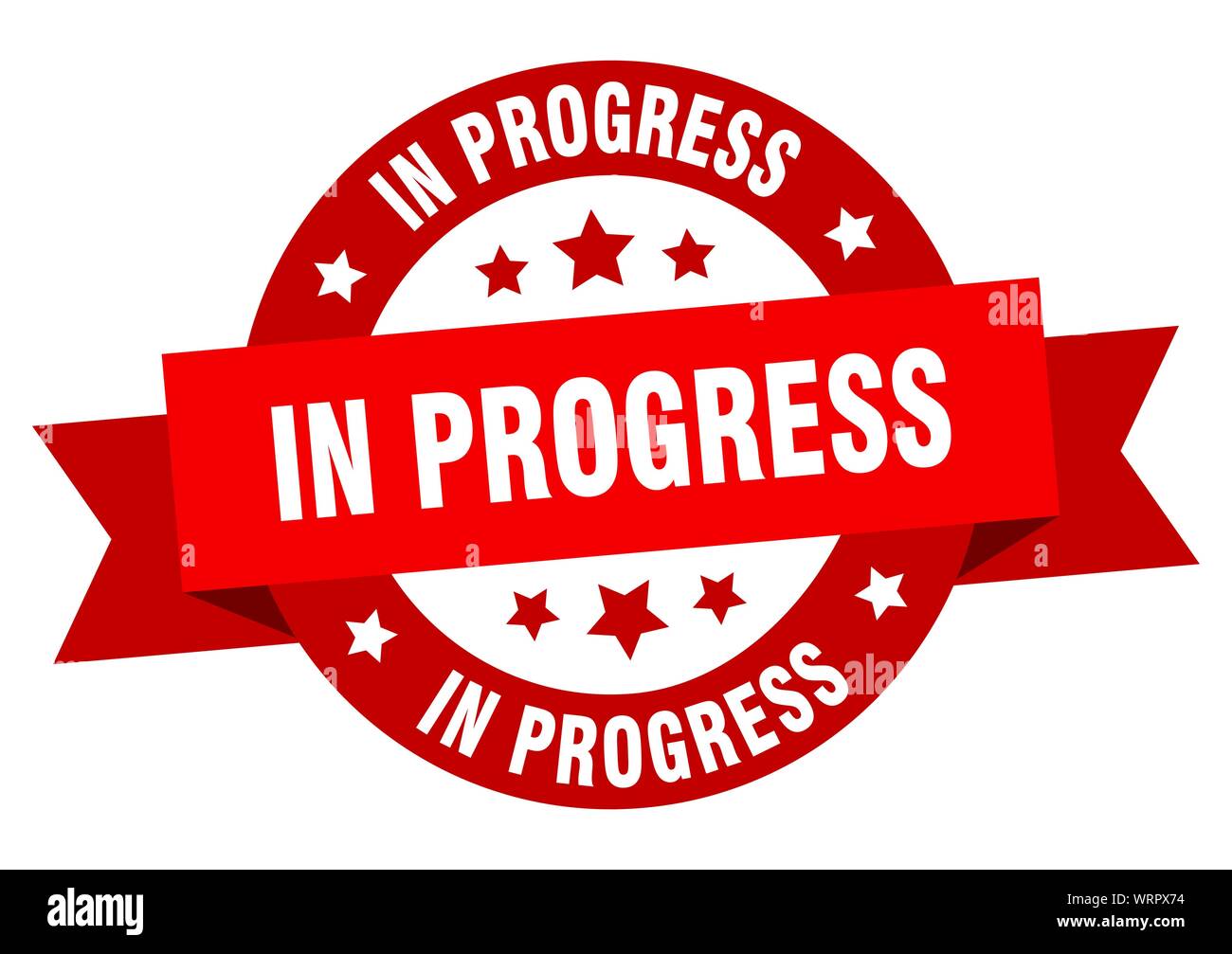 in progress ribbon. in progress round red sign. in progress Stock ...
