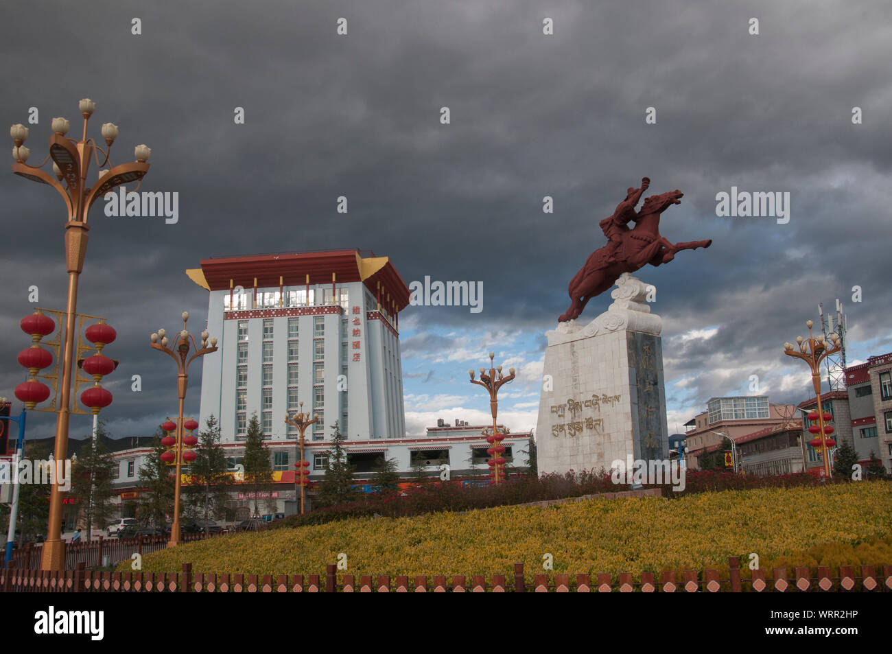 Modern buildings and statuary in Zhongdian, also known as Shangri-La, a majority-Tibetan town in Yunnan, China. Stock Photo