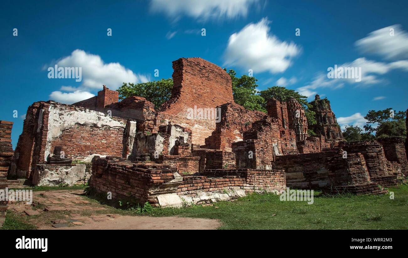 Old Ruin Temple On Field Against Sky Stock Photo