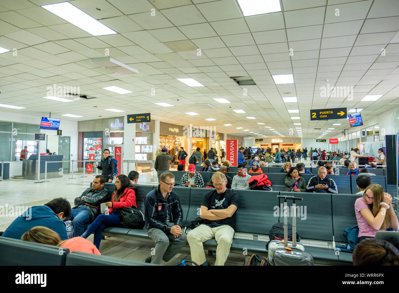 Passengers waiting to board at departure gates, Teniente Alejandro Velasco Astete International Airport, Cusco Airport, Cusco, Peru Stock Photo