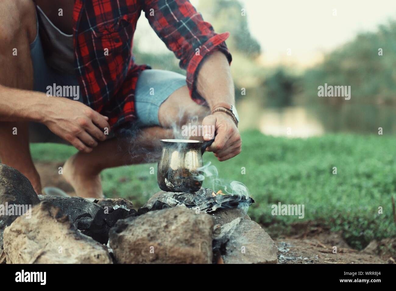 Boiling water on campfire hires stock photography and images Alamy