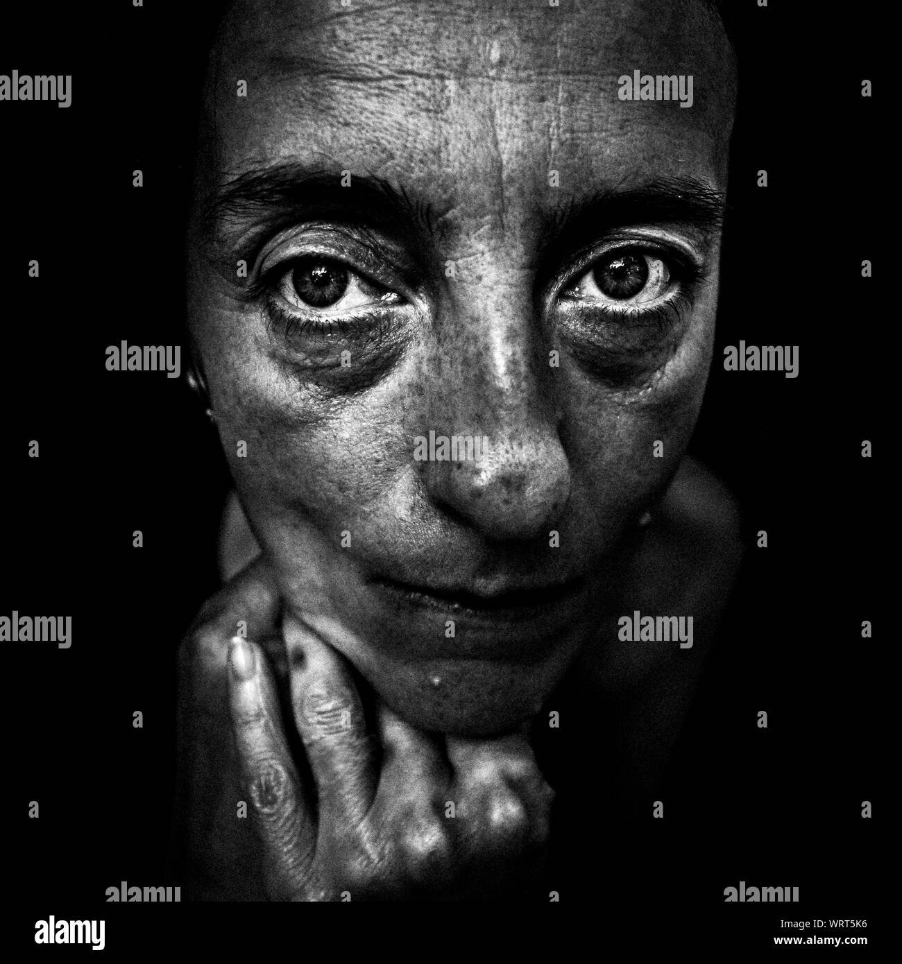 Black and white artistic portrait of a sad woman Stock Photo
