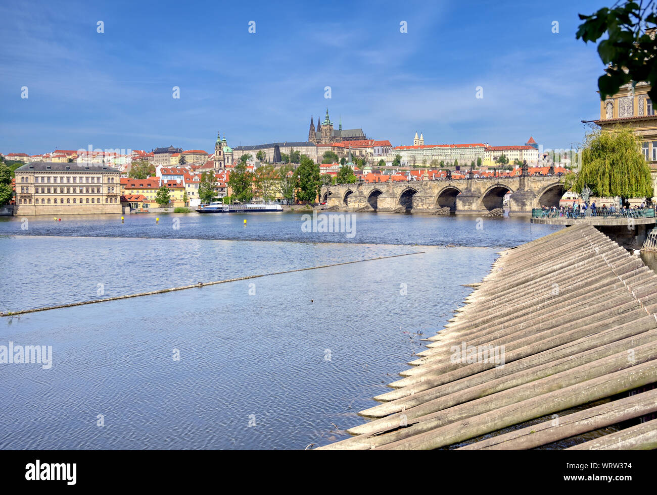 A view across the Charles Bridge and the Vltava River to Prague Castle and St. Vitas Cathedral in Prague, Czech Republic. Stock Photo