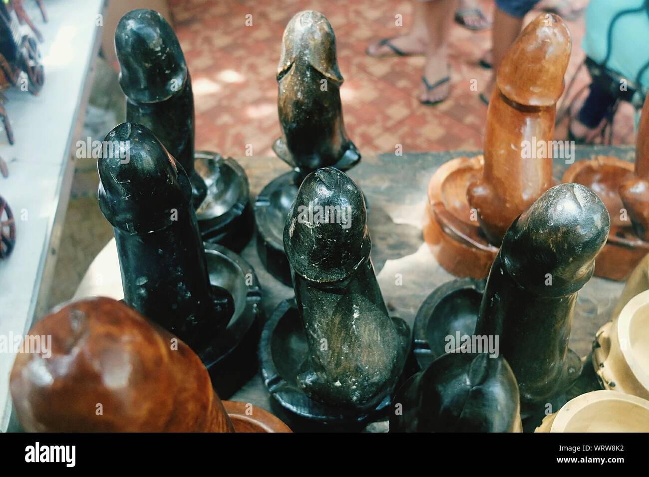 Close-up Of Phallus Shape Wooden Art For Sale On Table Stock Photo