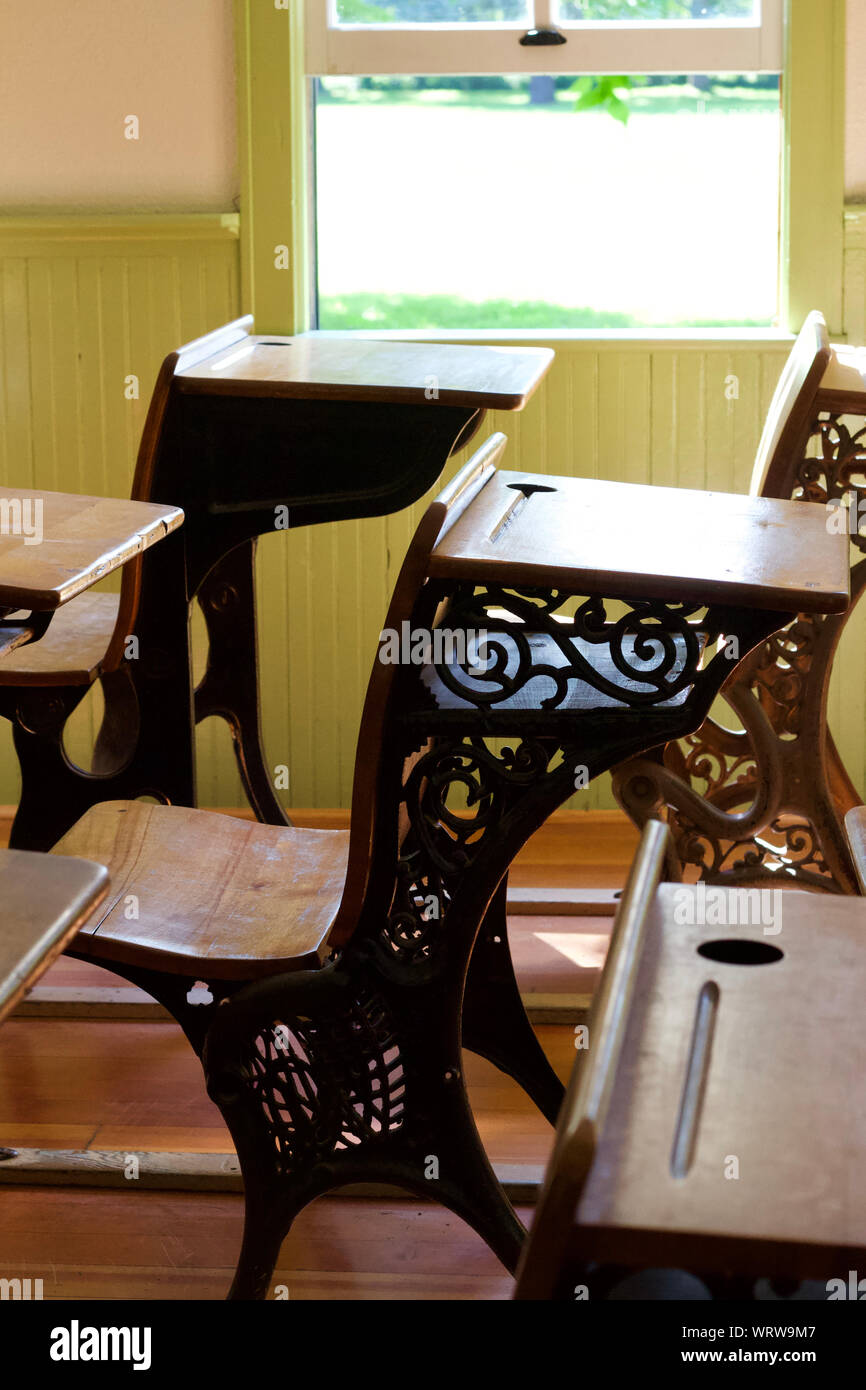 Interior view of a 19th century one room country school house with student desks in a rural midwest America setting Stock Photo