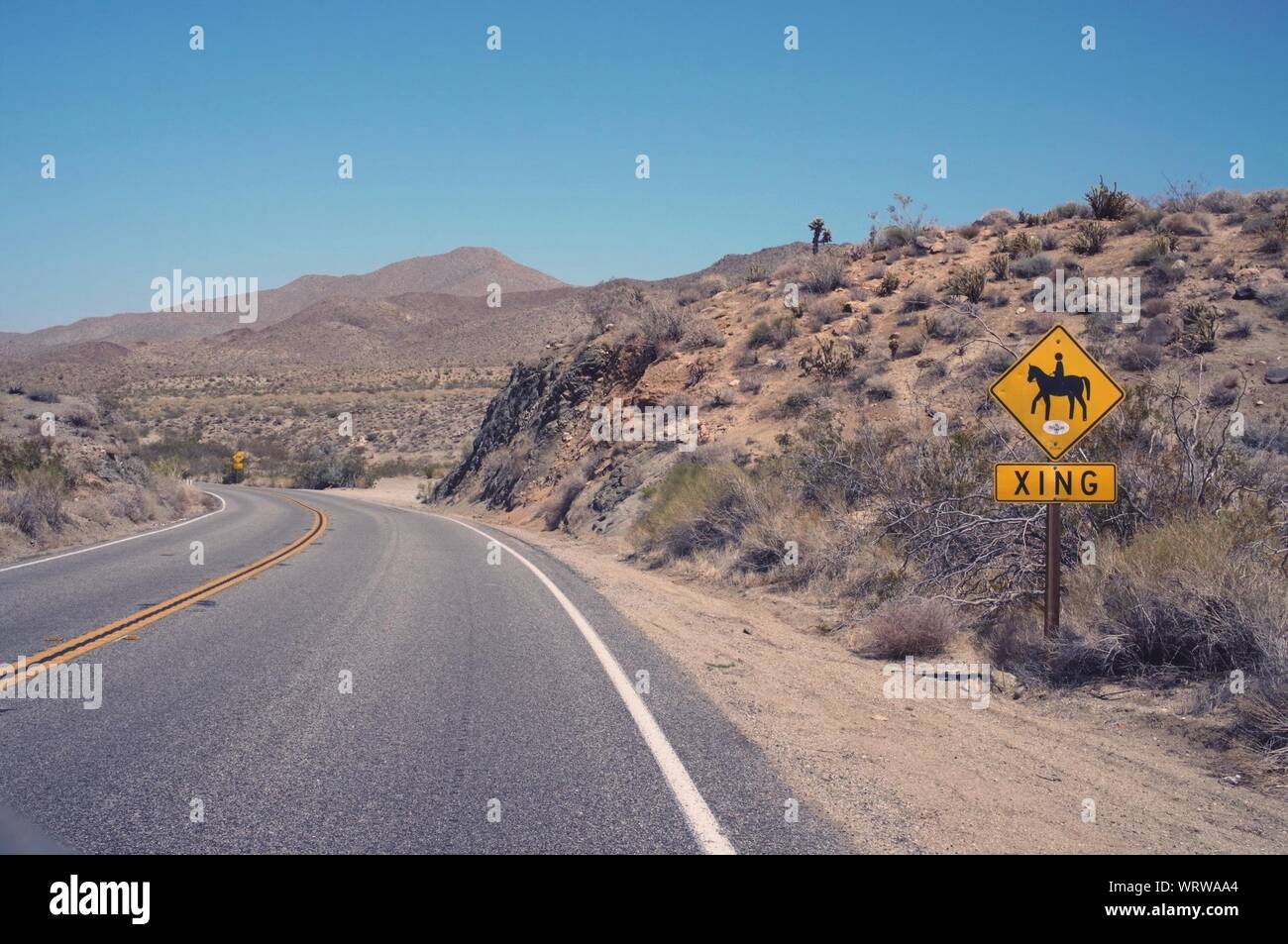 Sign By Road In Remote Area Stock Photo