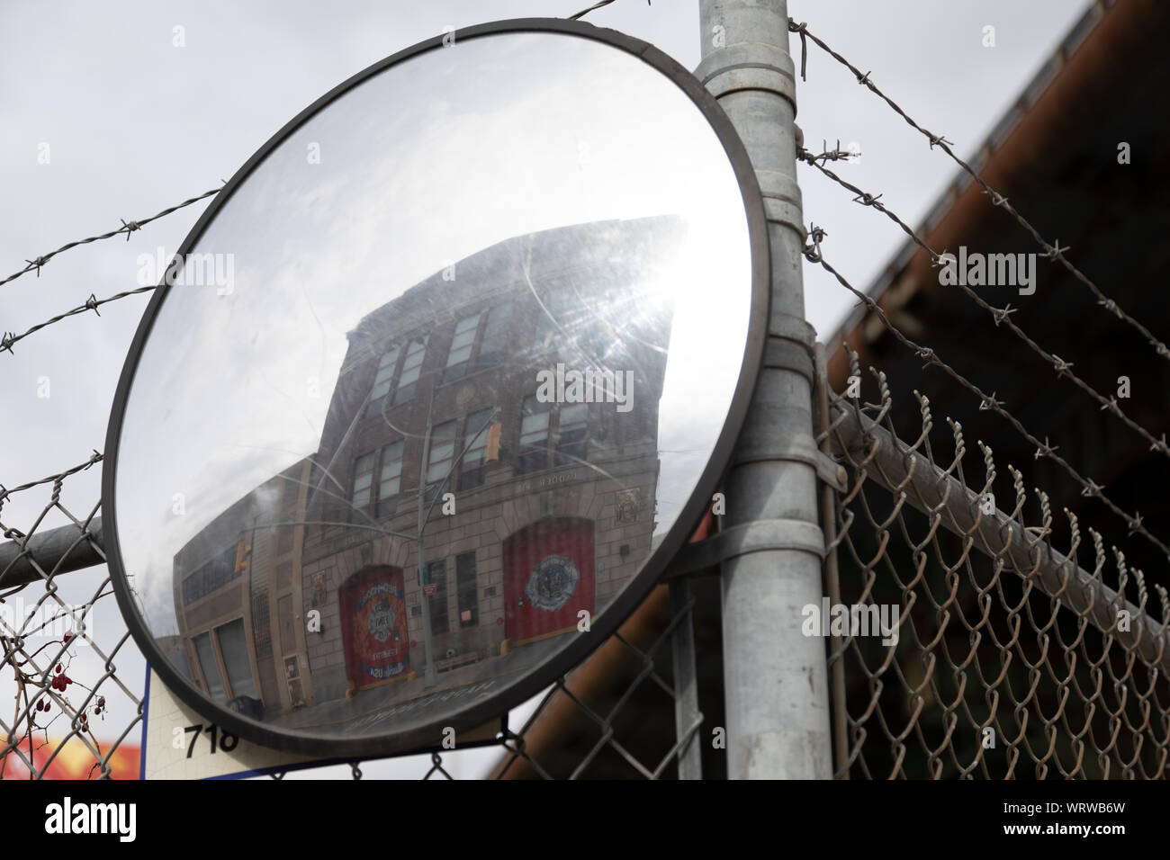 FDNY fire station reflected in mirror in Brooklyn, NY Stock Photo