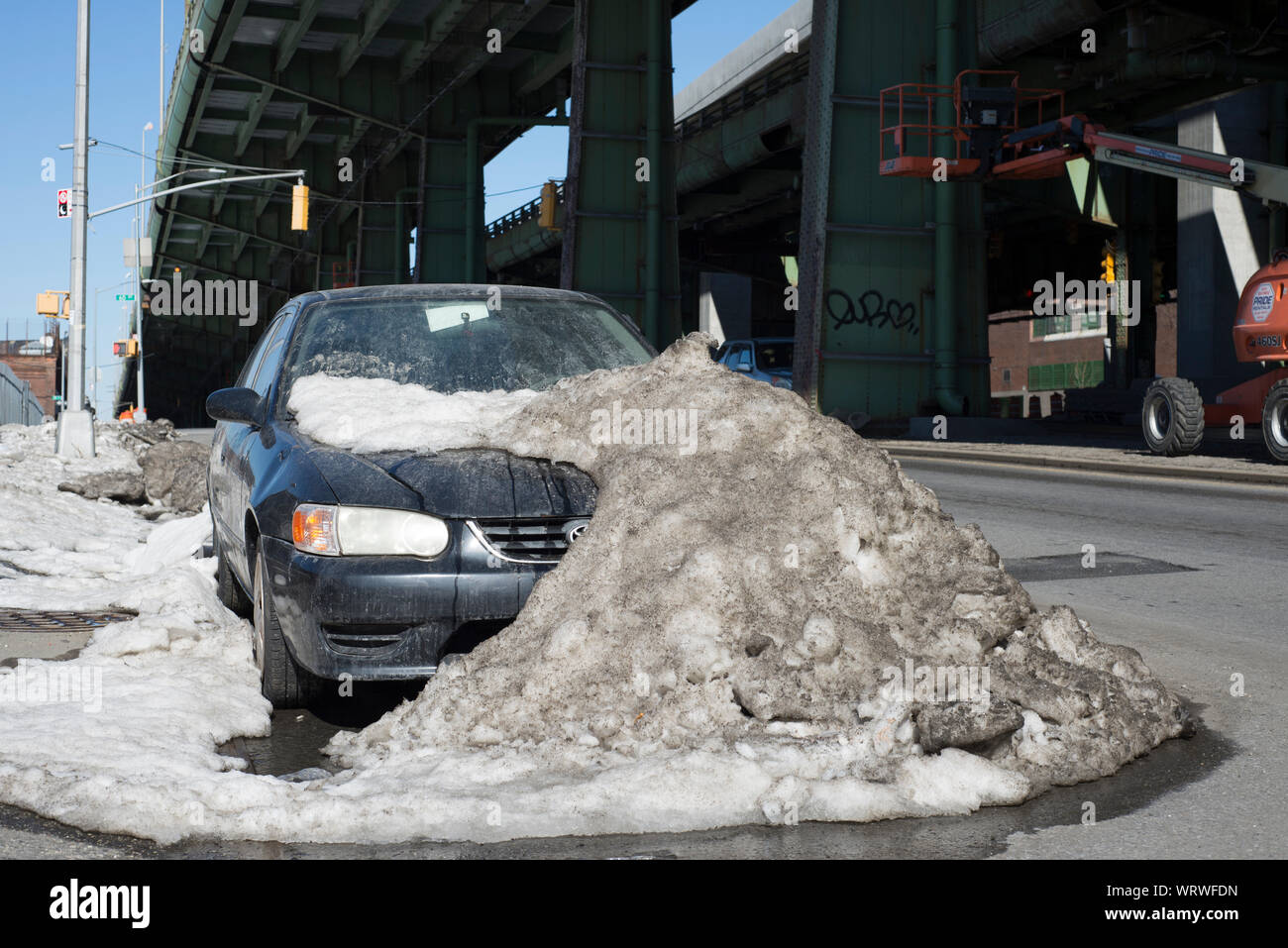 A car parked under the Gowanus Expressway in Sunset Park Brooklyn, New York. Stock Photo