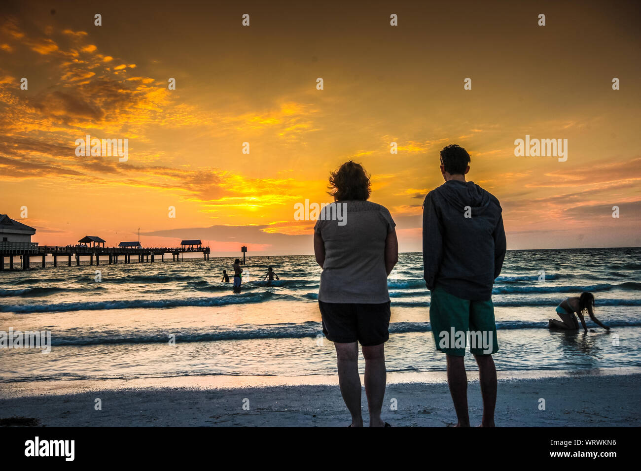American looking seniors enjoying sunset on the beach - Senior lifestyle Stock Photo