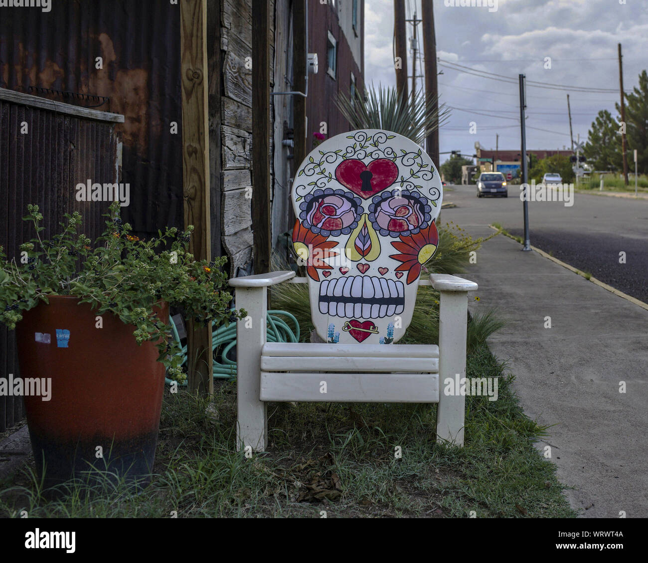 Chair adorned with a calavera, a Mexican traitional representation of a skull, in a street of Alpine, Texas. Stock Photo