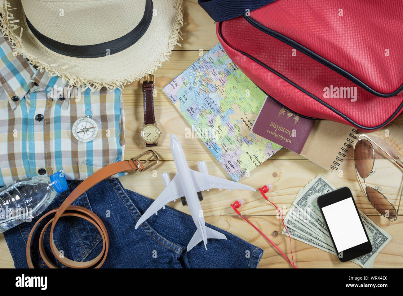 Travel concept with personal accessory on wooden plank Stock Photo