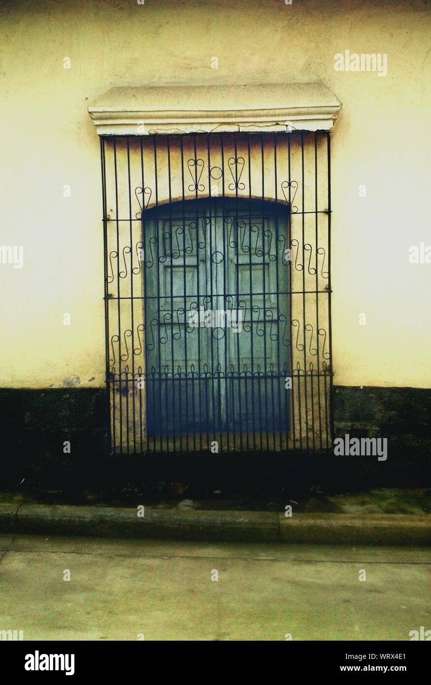 Metal Grate On Window Of House Stock Photo - Alamy