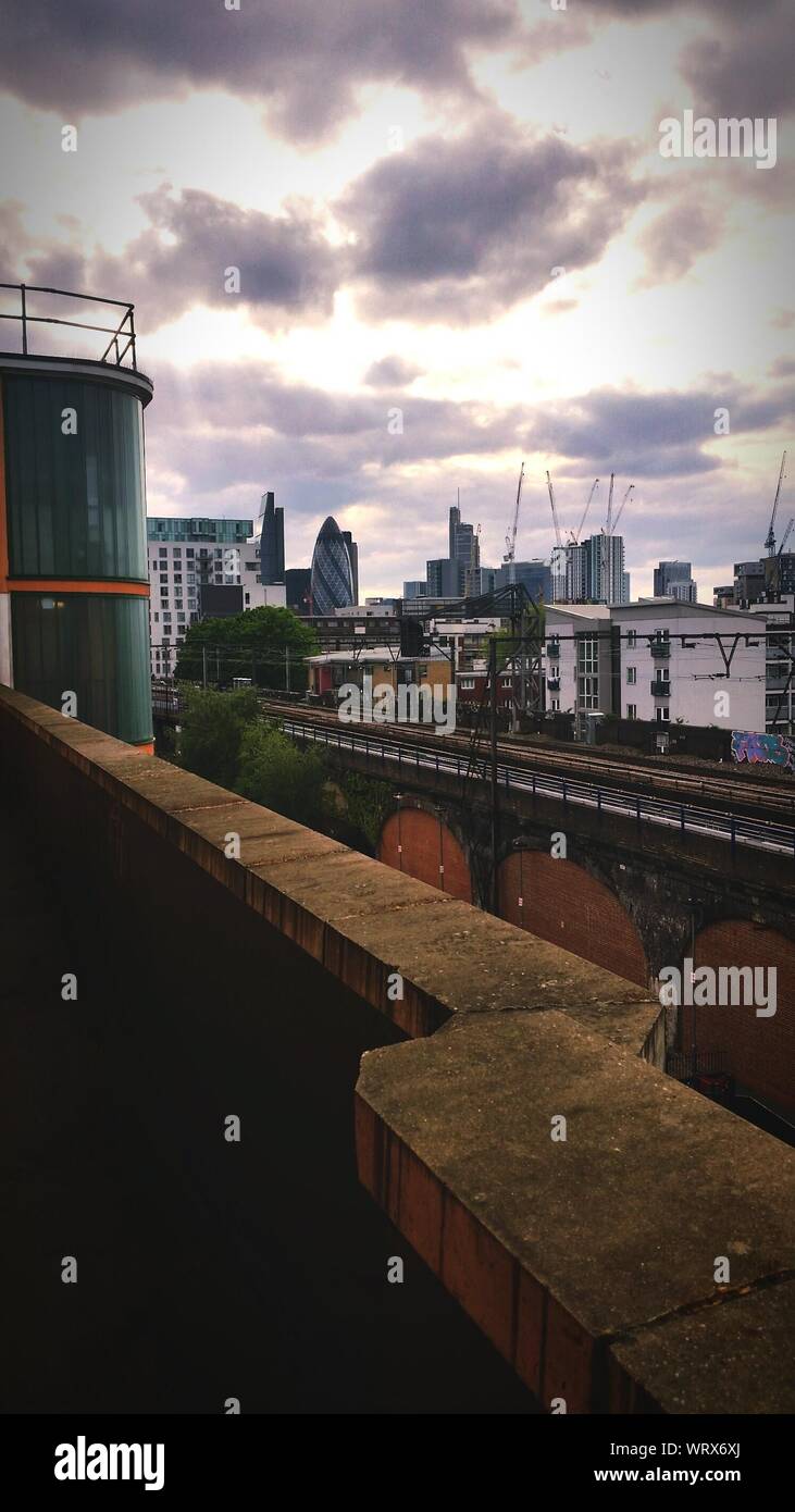 Subway Tracks And View Of City Skyline Stock Photo