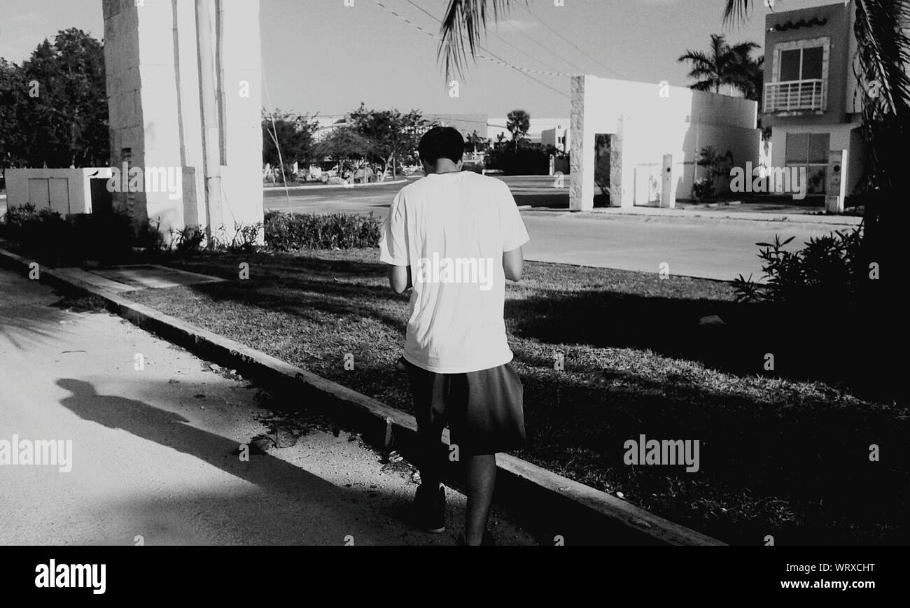 Young man walking not beach hi-res stock photography and images - Alamy
