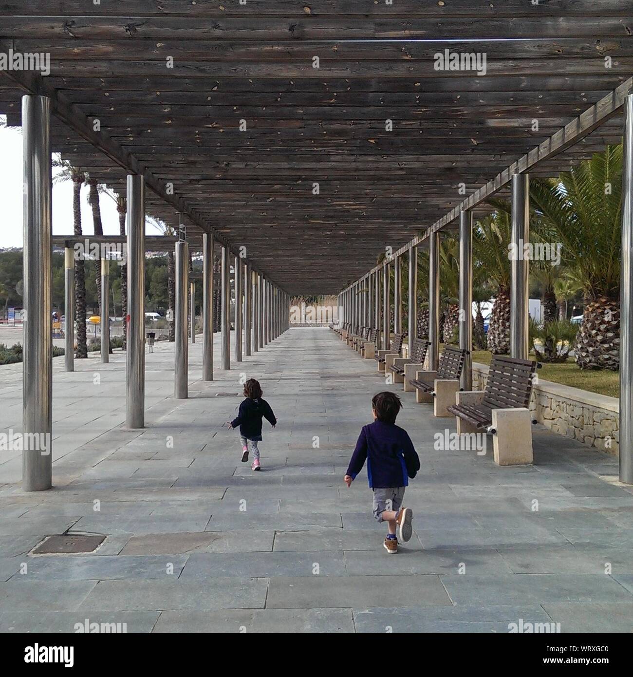 Children running indoors hi-res stock photography and images - Alamy