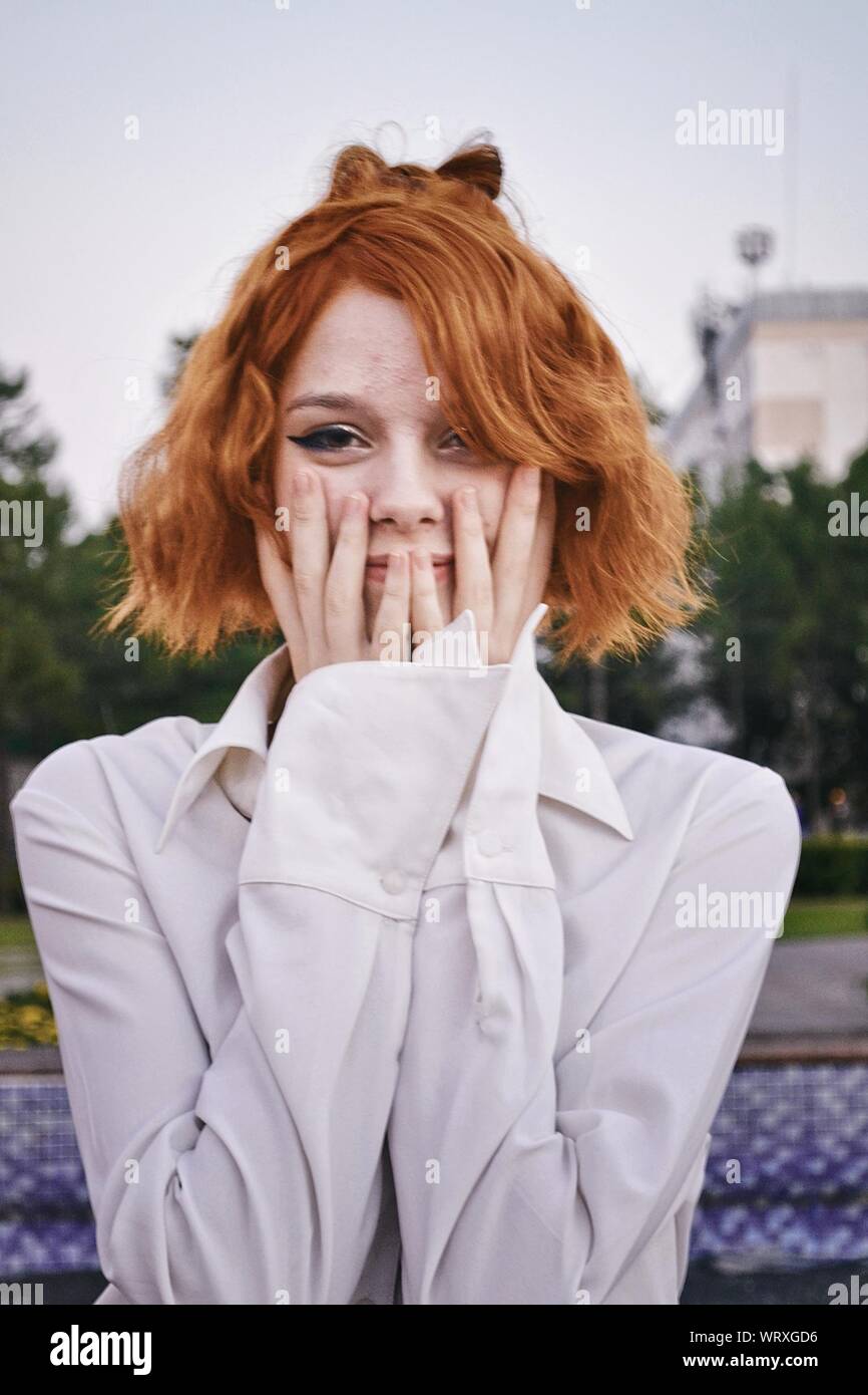 Woman with hands on face hi-res stock photography and images - Alamy