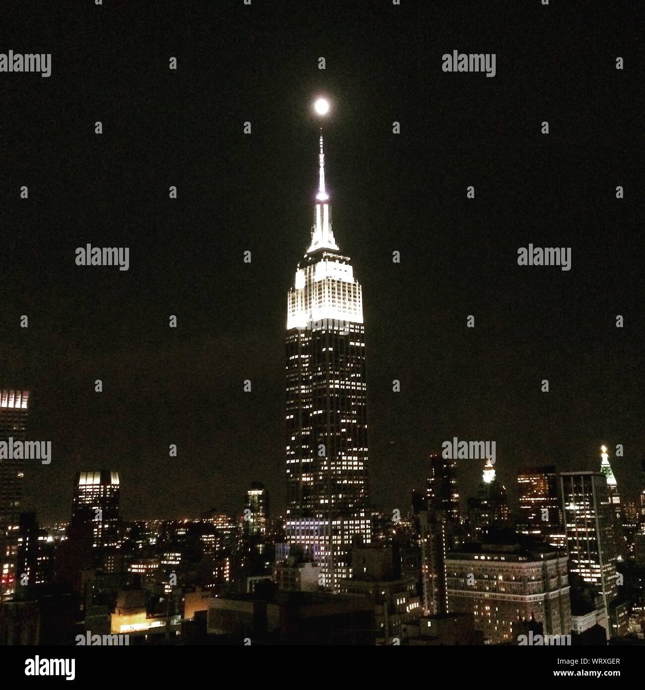 Empire state building and moon at night hi-res stock photography and ...