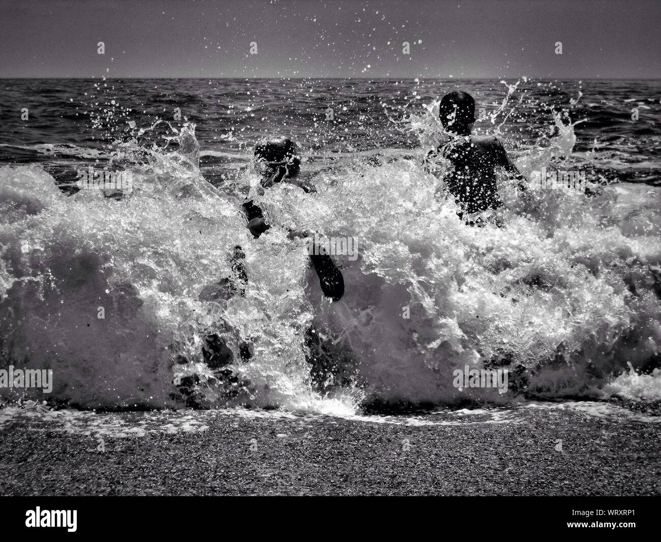 People splashing sea hi-res stock photography and images - Alamy