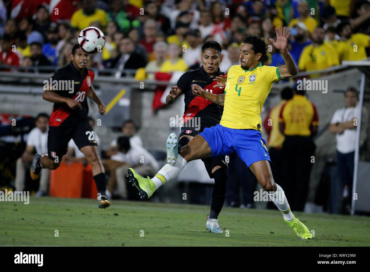 Los Angeles, California, USA. 10th Sep, 2019. Brazil defender Marquinhos (4) and Peru forward Raul Ruidiaz (11) vie for the ball during an International Friendly Soccer match between Brazil and Peru at the Los Angeles Memorial Coliseum in Los Angeles on Tuesday, September 10, 2019. Credit: Ringo Chiu/ZUMA Wire/Alamy Live News Stock Photo