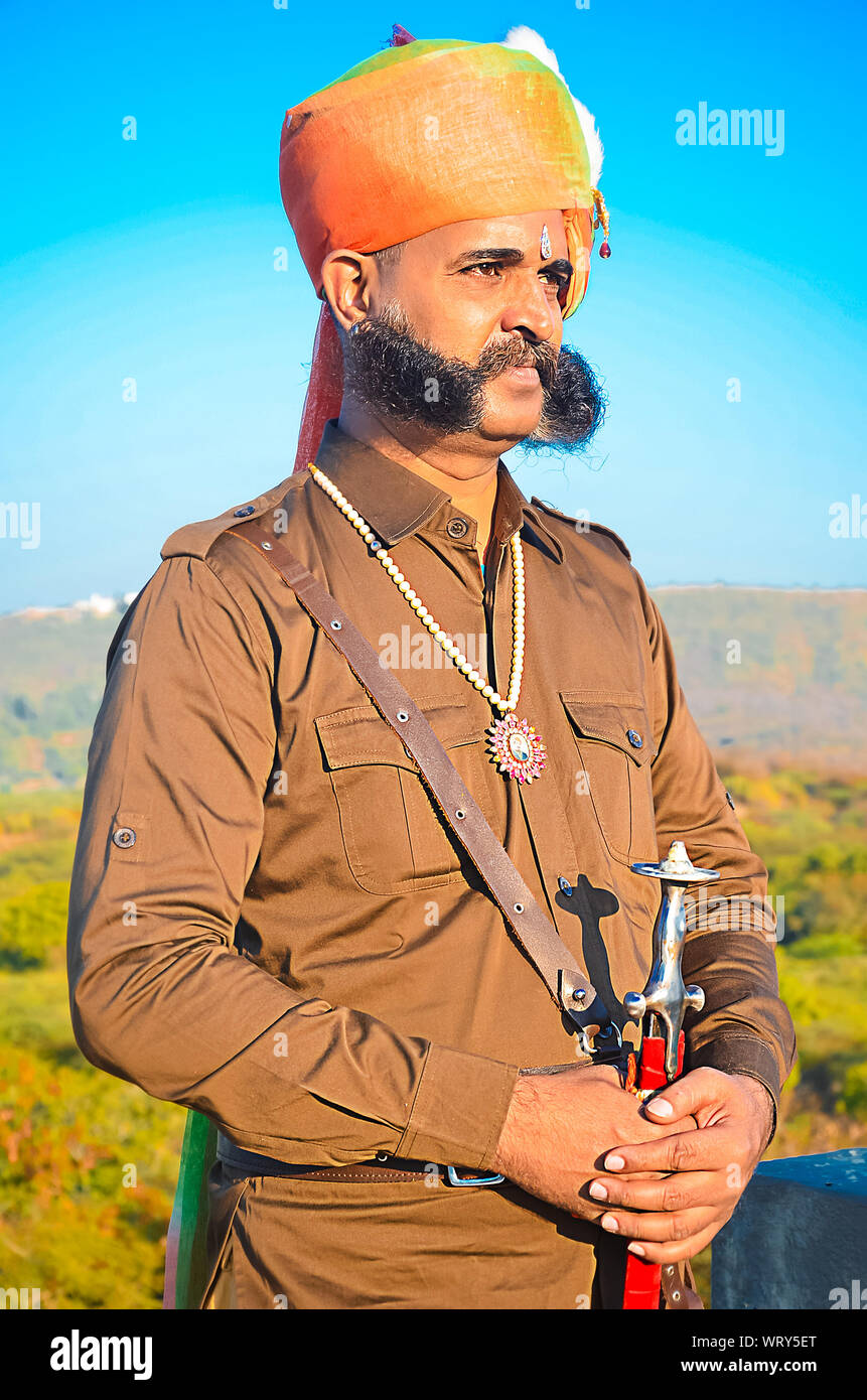 Jaisalmer, rajasthan, india - april 18th, 2018: Portrait of Indian village man with huge mustache wearing turban and traditional outfits. Stock Photo