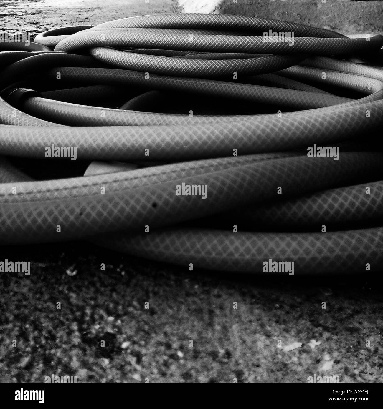 Close Up Of Cropped Gardening Hose On Ground Stock Photo Alamy