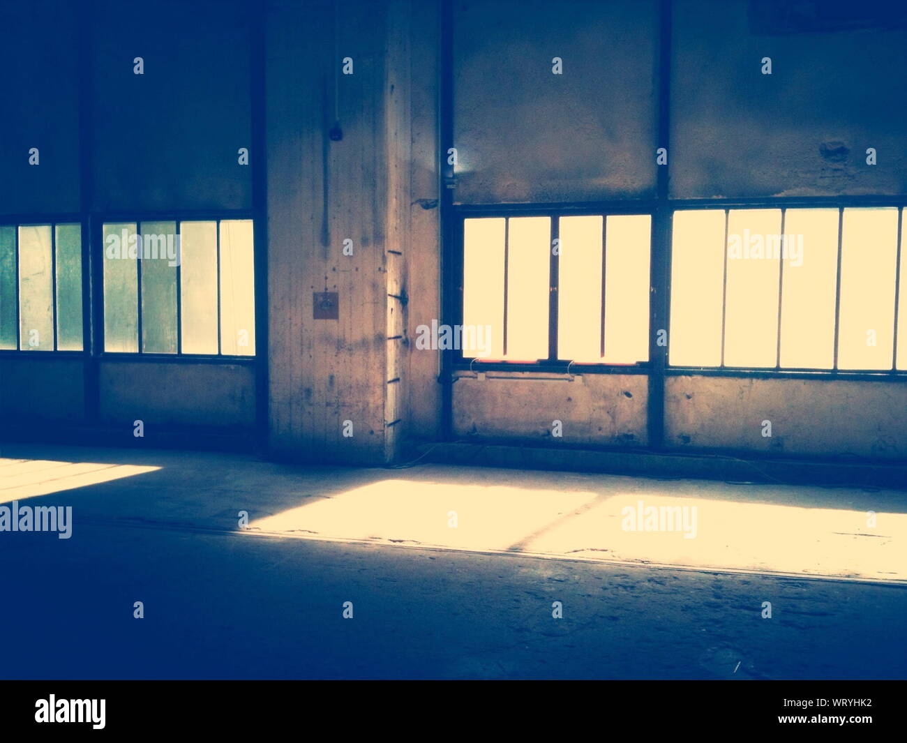 Desolate Building Interior With Windows Stock Photo