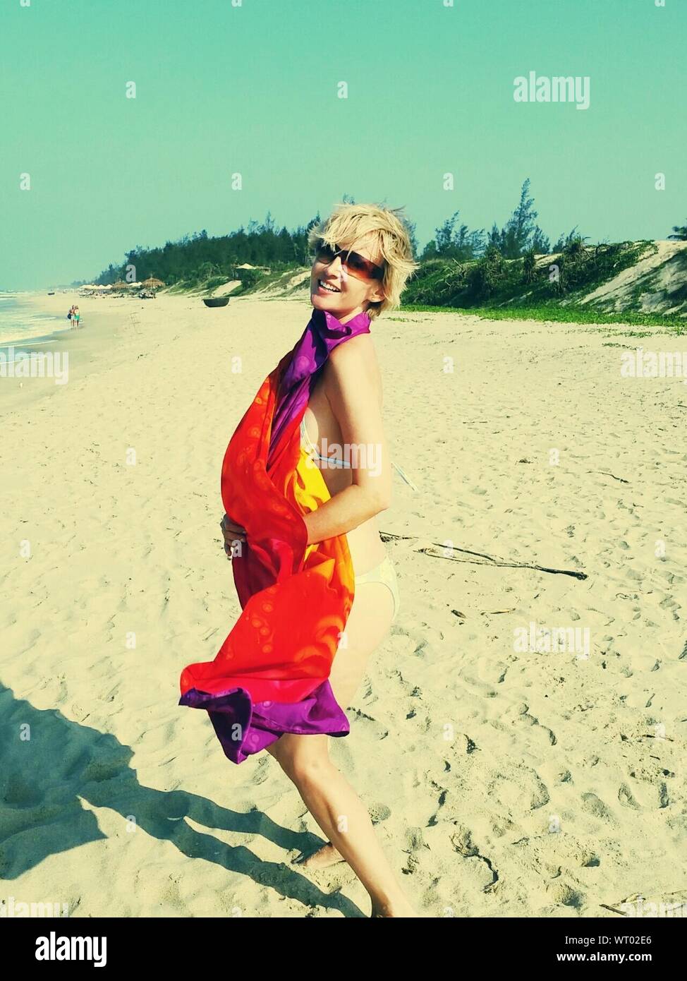 Woman posing on beach hi-res stock photography and images - Alamy