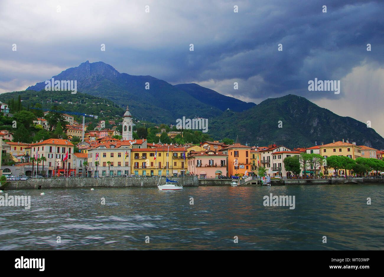 Como Lake At Menaggio By Mountains Against Cloudy Sky Stock Photo