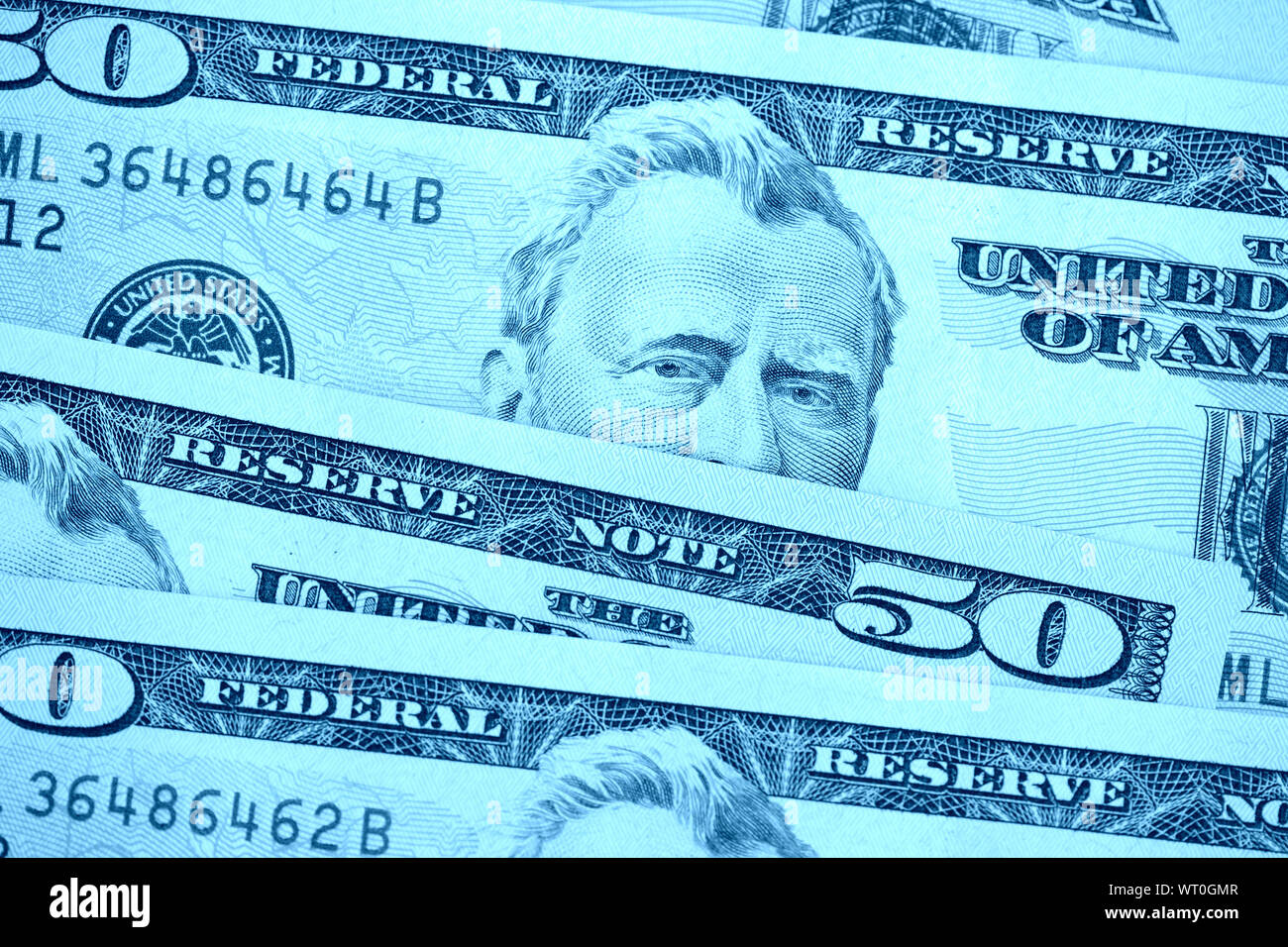 USD fifty dollar bills close up. Money background blue color toned Stock Photo