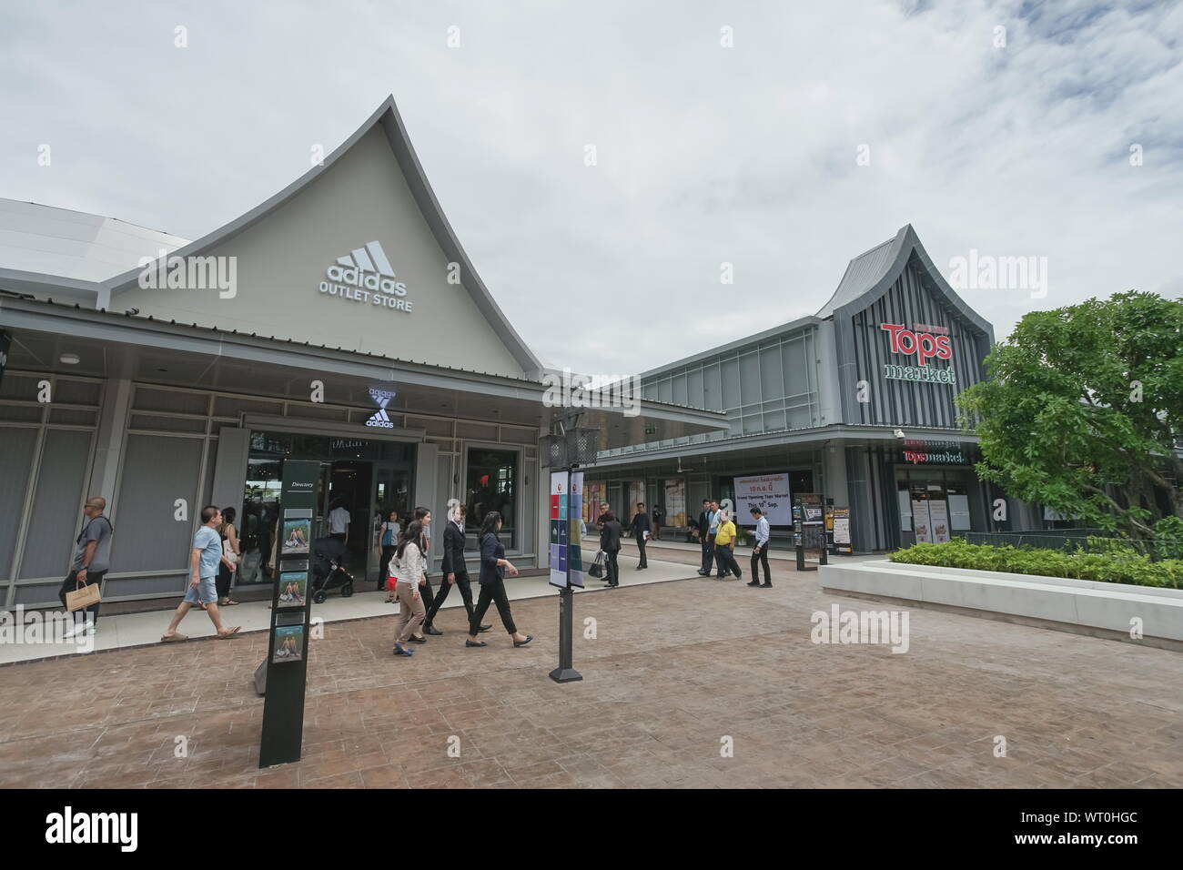 Samut Prakan, Thailand - September 06, 2019: Adidas Outlet Store and Tops Market in the new one shopping mall named Central Village. Stock Photo