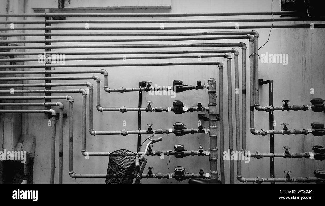 Water Pipes Against Wall Stock Photo Alamy