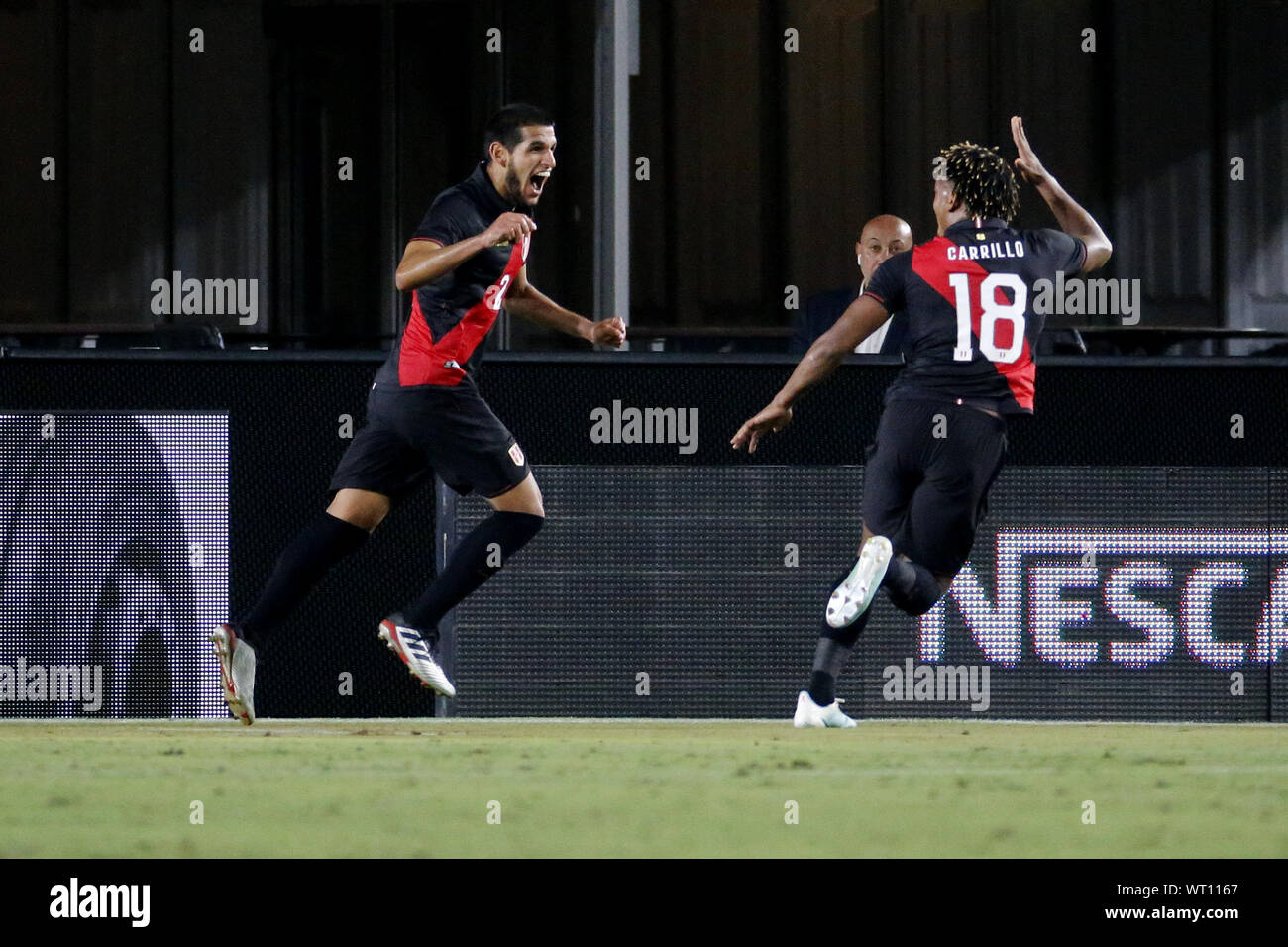 Los Angeles, California, USA. 10th Sep, 2019. Peru defender Luis Abram (2) celebrates his goal with Peru midfielder Andre Carrillo (18) during an International Friendly Soccer match between Brazil and Peru at the Los Angeles Memorial Coliseum in Los Angeles on Tuesday, September 10, 2019. Credit: Ringo Chiu/ZUMA Wire/Alamy Live News Stock Photo